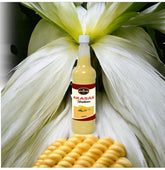 May include: A 250ml bottle of Aksan Haitian corn drink. The bottle is clear, showing a pale yellow liquid. The label is dark red and features the brand name 'Aksan' and 'Haitian' in white text. A small image of corn is also on the label. The bottle is positioned in front of corn husks and ears of corn.